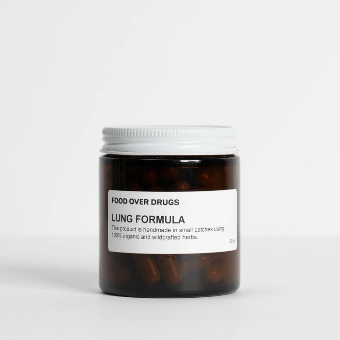 Herbal supplement jar with white label, dark brown capsules, white screw cap
