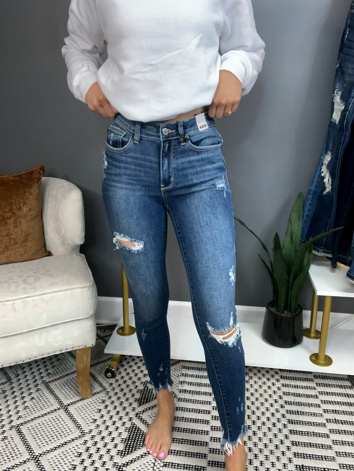Mid Rise Raw Hem Distressed Skinny Jeans