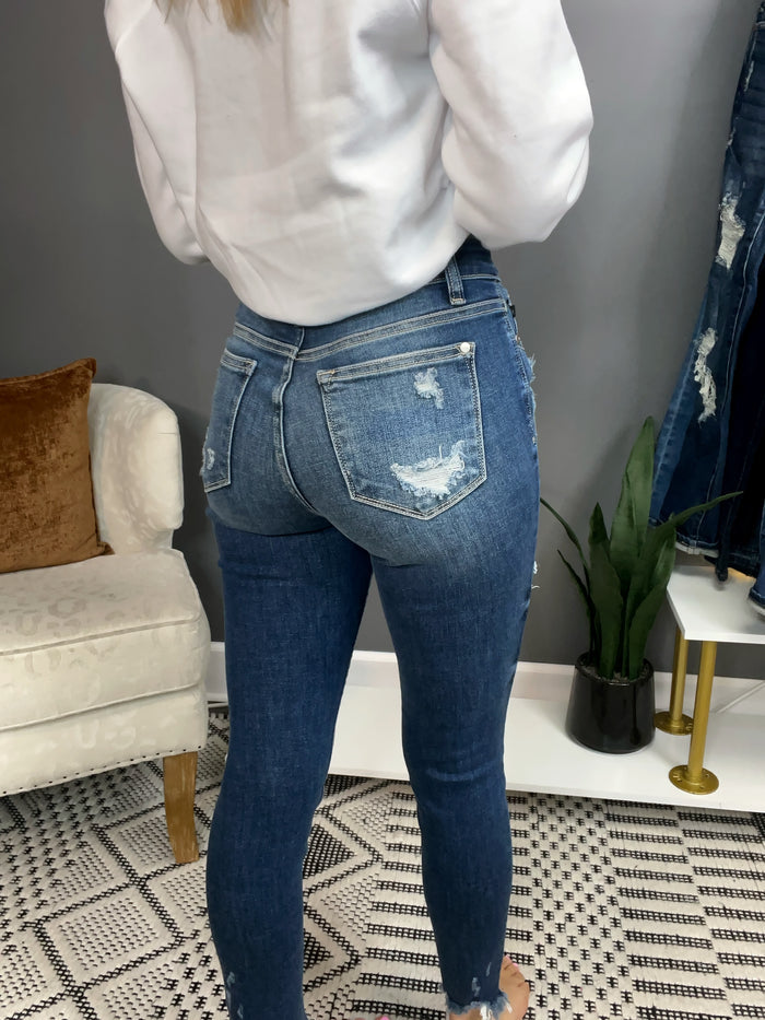 Mid Rise Raw Hem Distressed Skinny Jeans