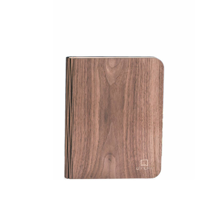 Natural wood smart book light by Gingko Design, compact lamps with adjustable brightness and sleek wooden finish.