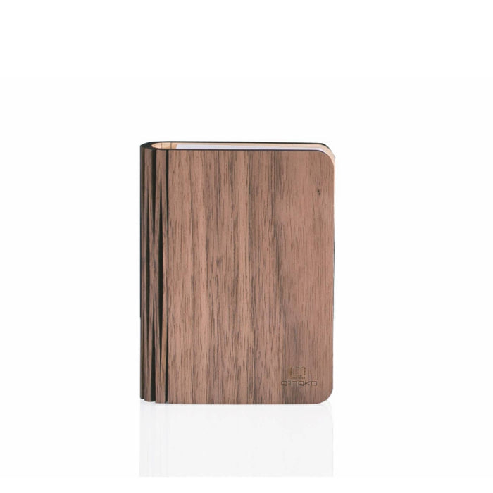 Natural wood smart book light by Gingko Design, featuring a sleek, modern lamp with a warm wood finish and integrated lighting.