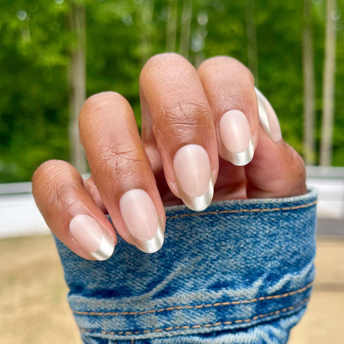Neutral Chrome French - Press-On | Medium | Oval nails shown with shimmery silver tips and natural base for easy at home manicure