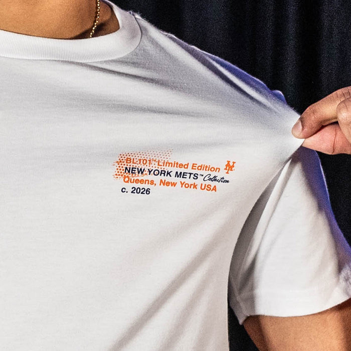 Adult model wearing white graphic tee with "New York Mets Drip" design