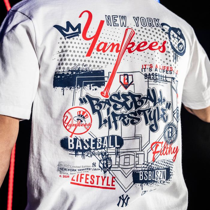 Adult model wearing white graphic tee with "New York Yankees Drip" design