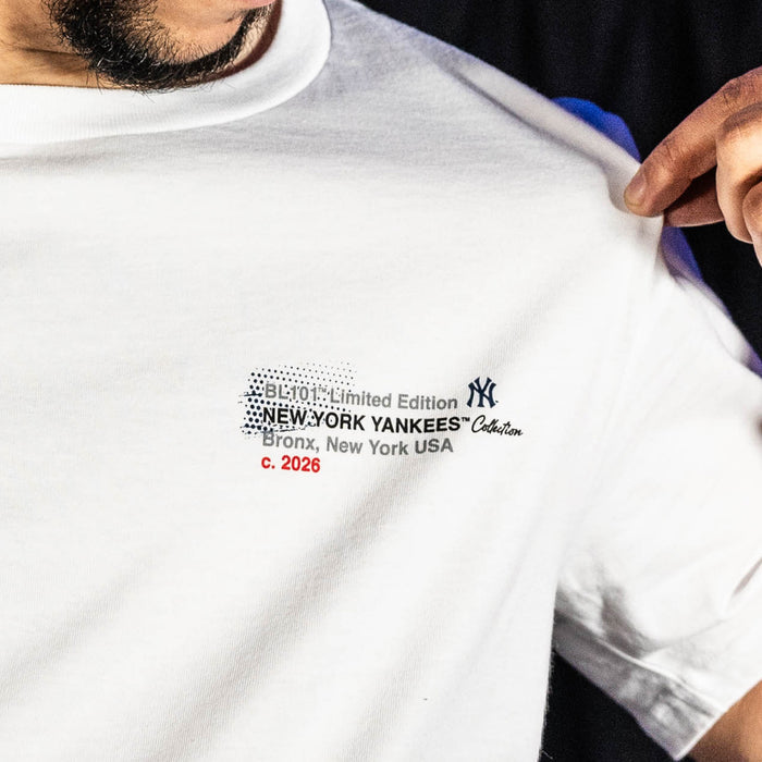 Adult model wearing white graphic tee with "New York Yankees Drip" design
