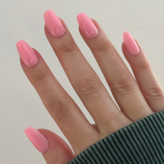 O&J Pink - Press-On | Medium | Coffin medium cotton candy pink false nails shown on hand with soft natural light