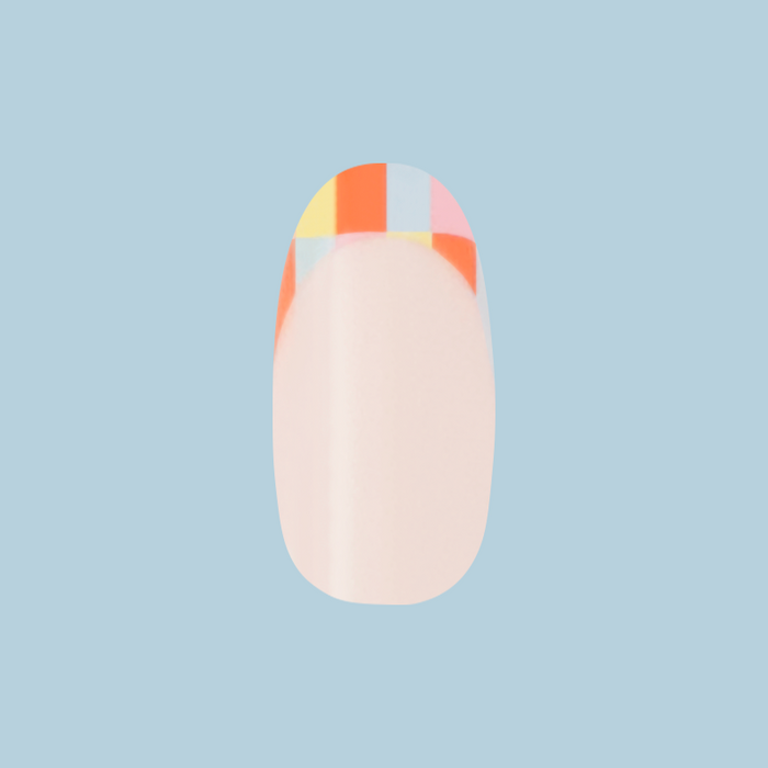 Parade French - Press-On | Medium | Oval with colorful multi-color checker tip on natural nail for easy at-home manicure
