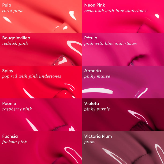 A grid of nine vibrant Péonie lipsticks by Manucurist, from Neon Pink to Victoria Plum, showcases gel polish-inspired pink and raspberry shades, each swatch labeled with its name and distinct color tone.