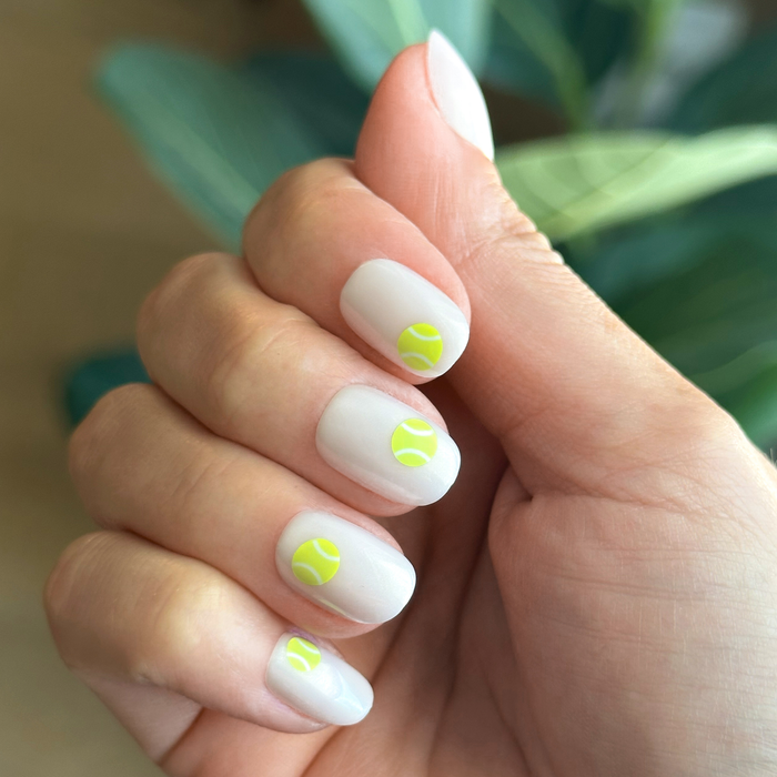 Perfect Serve - Press-On | Extra Short | Squoval with sheer neutral polish and vivid tennis ball accents for an easy mani
