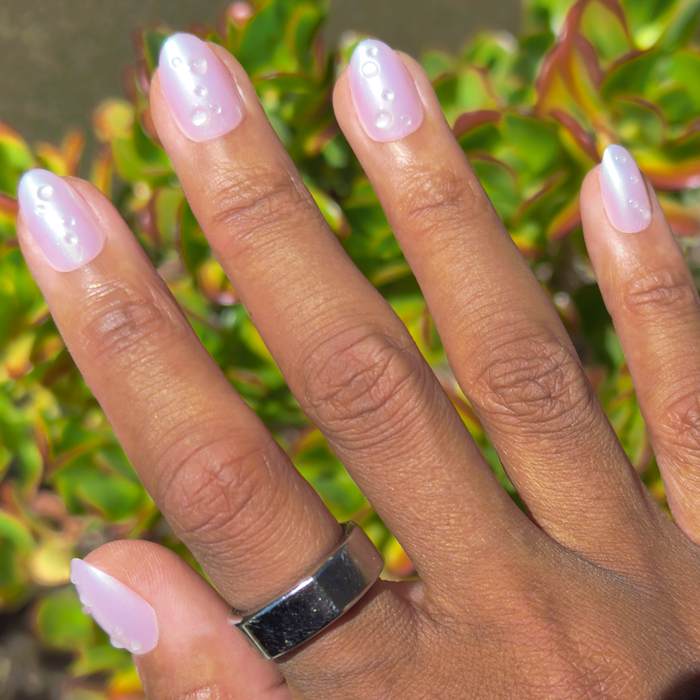 Purple Puka Raindrops - Press-On | Short | Almond with iridescent lavender nails and raised 3D raindrop details for mani