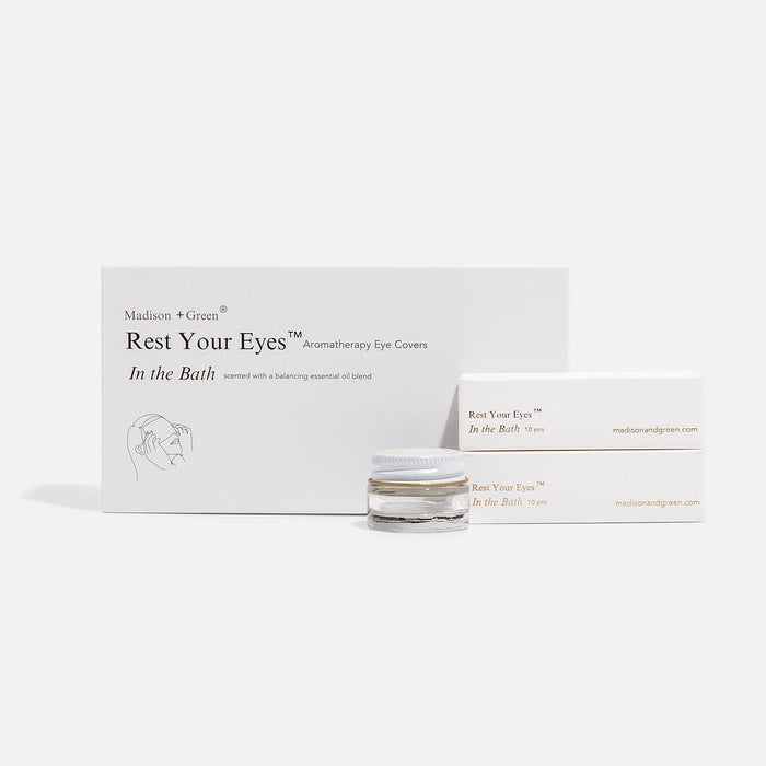 Aromatherapy eye cover set box with small glass jar beside it