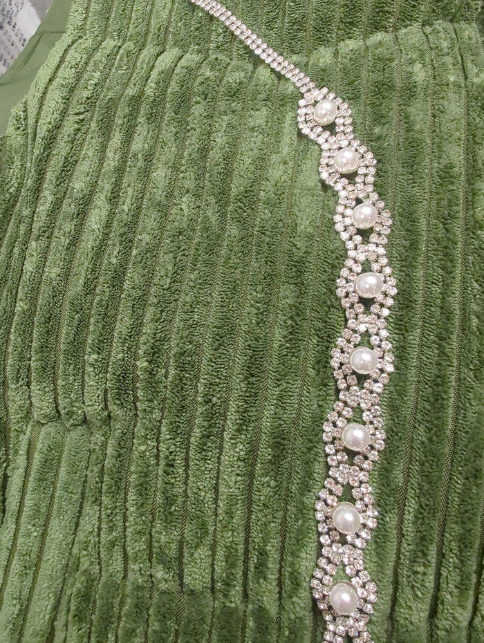Joia rhinestone and pearl belt featuring sparkling rhinestones and elegant pearls on a sleek fabric strap.