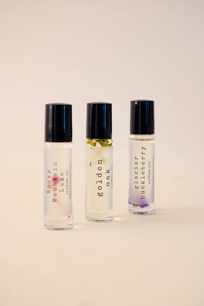 Hyalite & Co roll-on perfume oils with elegant glass bottle and silver cap, showcasing the sleek, portable perfume container.