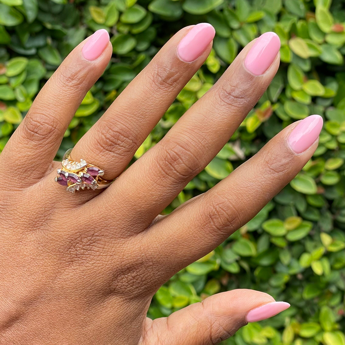 Hand with nails coated in Saltwater Taffy - Gel for a sheer pink long-lasting gel manicure at home or salon