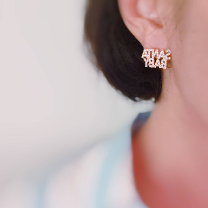 Ellison+Young Santa Baby crystal stud earrings with festive holiday design and sparkling crystal accents.