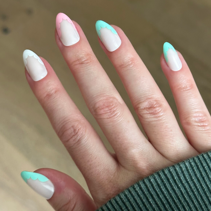 Scalloped French - Press-On | Medium | Almond nails with pastel scallop tips in soft pink and mint for an easy mani
