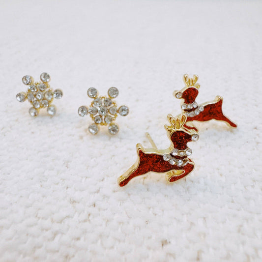 Ellison+Young snowflake stud earrings featuring delicate silver snowflake designs on small, elegant earrings.