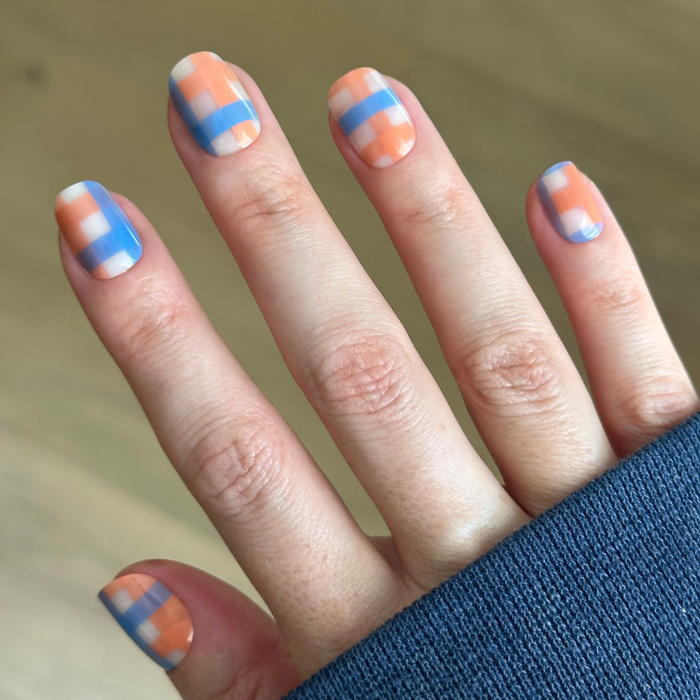 Soft Plaid - Press-On | Extra Short | Squoval nails with bold orange and blue large plaid design for an easy mani