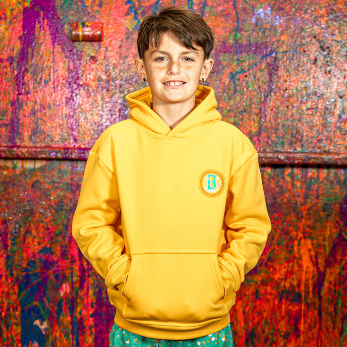 Child wearing a orange hoodie with a BL101 logo against a colorful, abstract wall.
