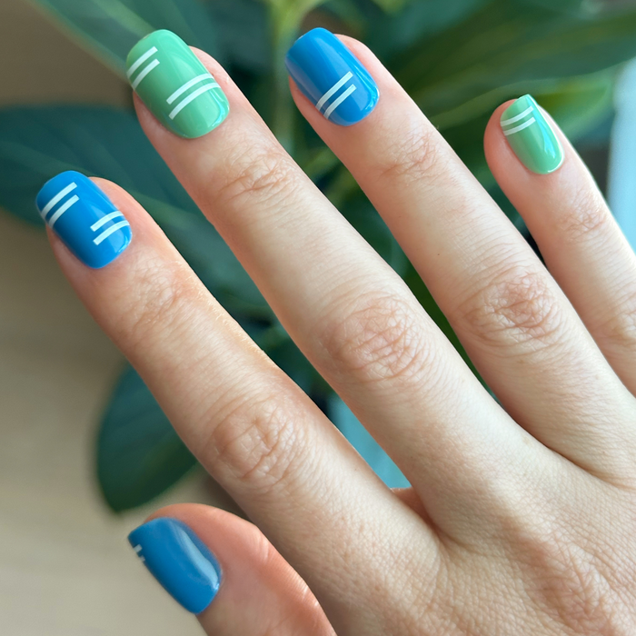 Sporty Stripes - Press-On | Extra Short | Squoval with blue and green nails and white stripe details for easy at-home manicure