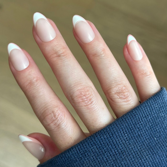 Study Hall Open French - Press-On | Medium | Almond nails with soft pink base and white classic French tips for easy at-home mani