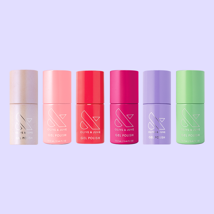 Six vibrant gel polish bottles in pastel and bold shades from the Summer Bestsellers Gel Mani System by Olive and June