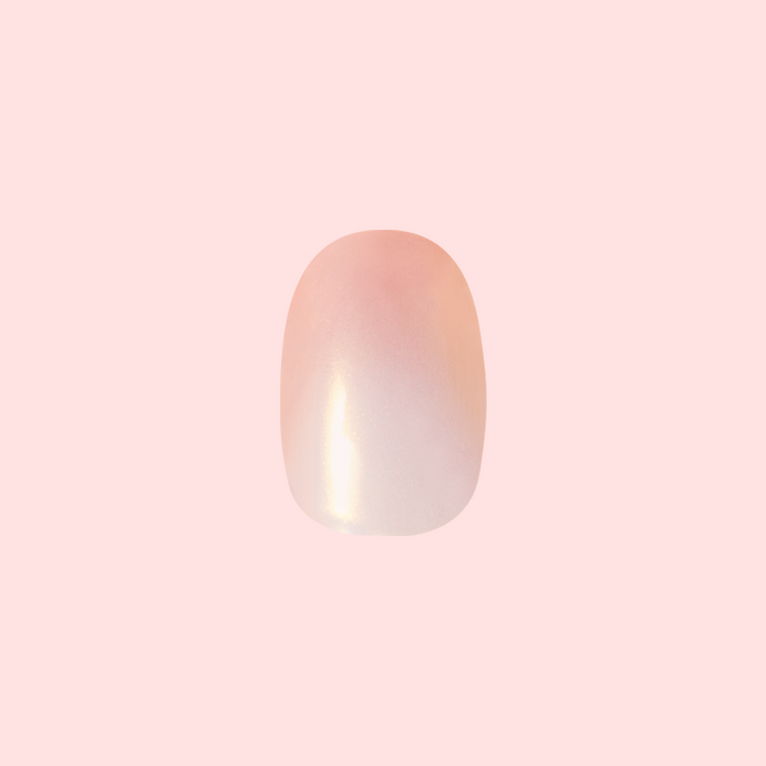 Sunset Gradient - Press-On | Short | Round featuring a peachy golden shimmer gradient press-on false nail for easy at-home mani