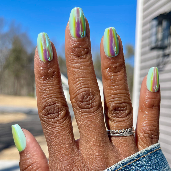 Teal Glass Chrome - Press-On | Medium | Coffin iridescent glassy teal medium coffin press-on nails on hand outdoors