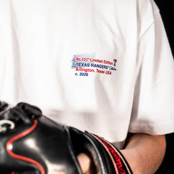 Adult model wearing white graphic tee with "Texas Rangers Drip" design