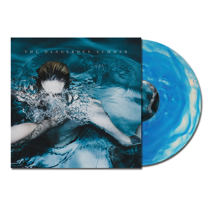 A blue/clear Smash vinyl record by The Dangerous Summer partially slides from its album cover, which features underwater artwork with a distorted face and the band’s name at the top.