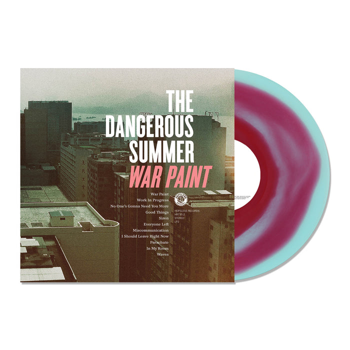A limited edition electric blue and red swirl vinyl by The Dangerous Summer is partially pulled from its cover, which displays city buildings at sunset along with the album title "War Paint" and a track list.