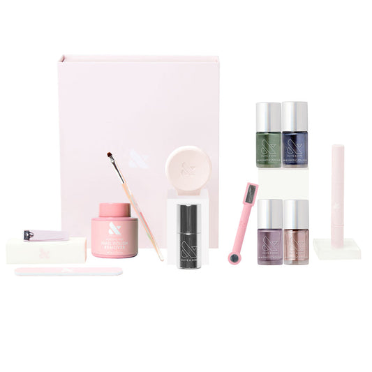 The Magnetics System with velvet magnetic nail polishes, magnetic wand, remover, and manicure tools for at-home nail care.