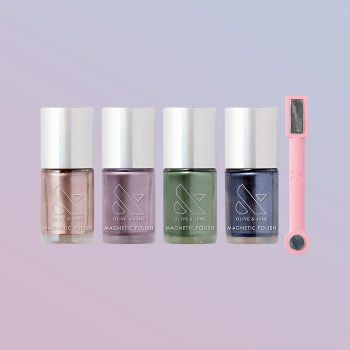 The Magnetics System with four velvet magnetic nail polishes and a pink magnetic wand for salon-quality at-home manicures