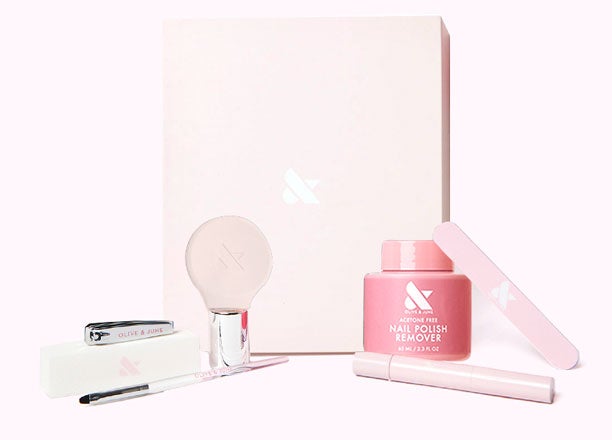 The O&J Mani System - 1 Polish with acetone-free remover, nail file, brush, and clipper in soft pink packaging by Olive and June