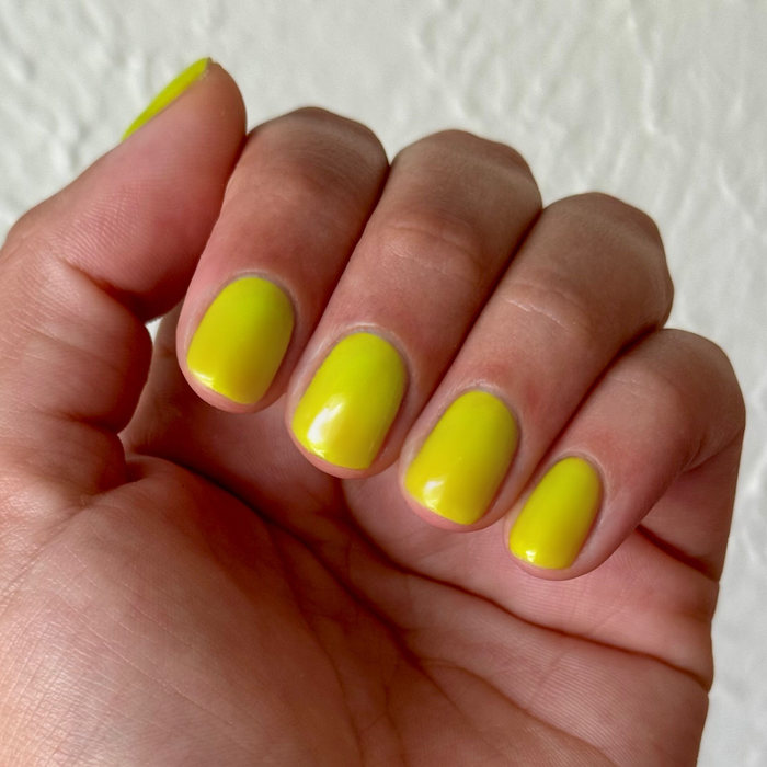 Time To Re-apply - Gel bright yellow green gel polish on natural nails with smooth glossy finish for a fresh manicure