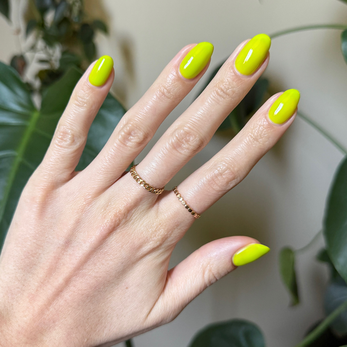 Time To Re-apply - Gel bright yellow green gel polish on nails with glossy finish and delicate gold rings accessory
