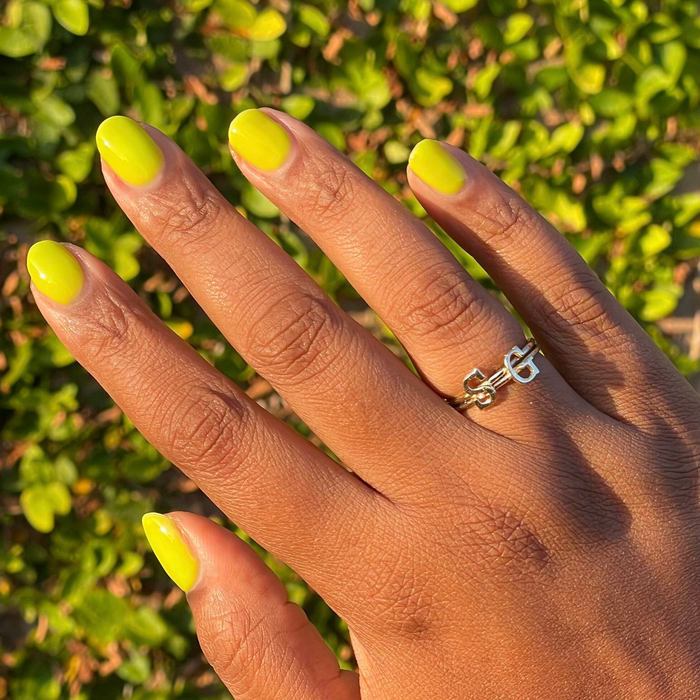 Time To Re-apply - Gel bright yellow green gel polish on natural nails with smooth glossy finish in sunlight