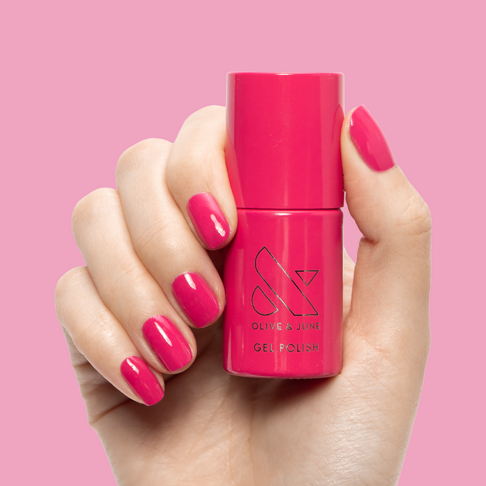 XOXO - Gel shown on nails with bright hot pink polish for a fun, long-lasting at-home mani by Olive and June