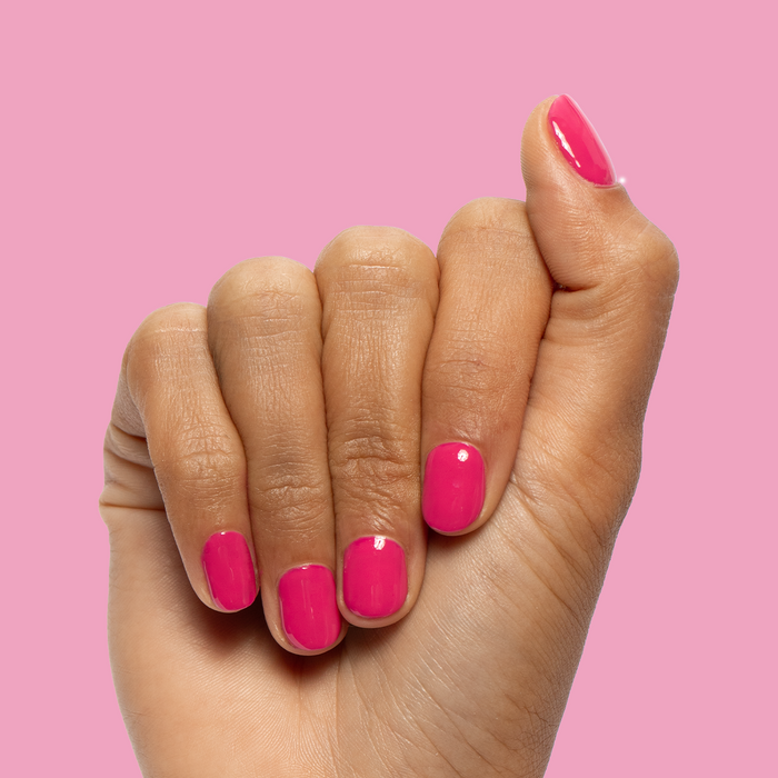 XOXO - Gel shown on nails in vibrant hot pink for a bright, long-lasting at-home gel manicure by Olive and June